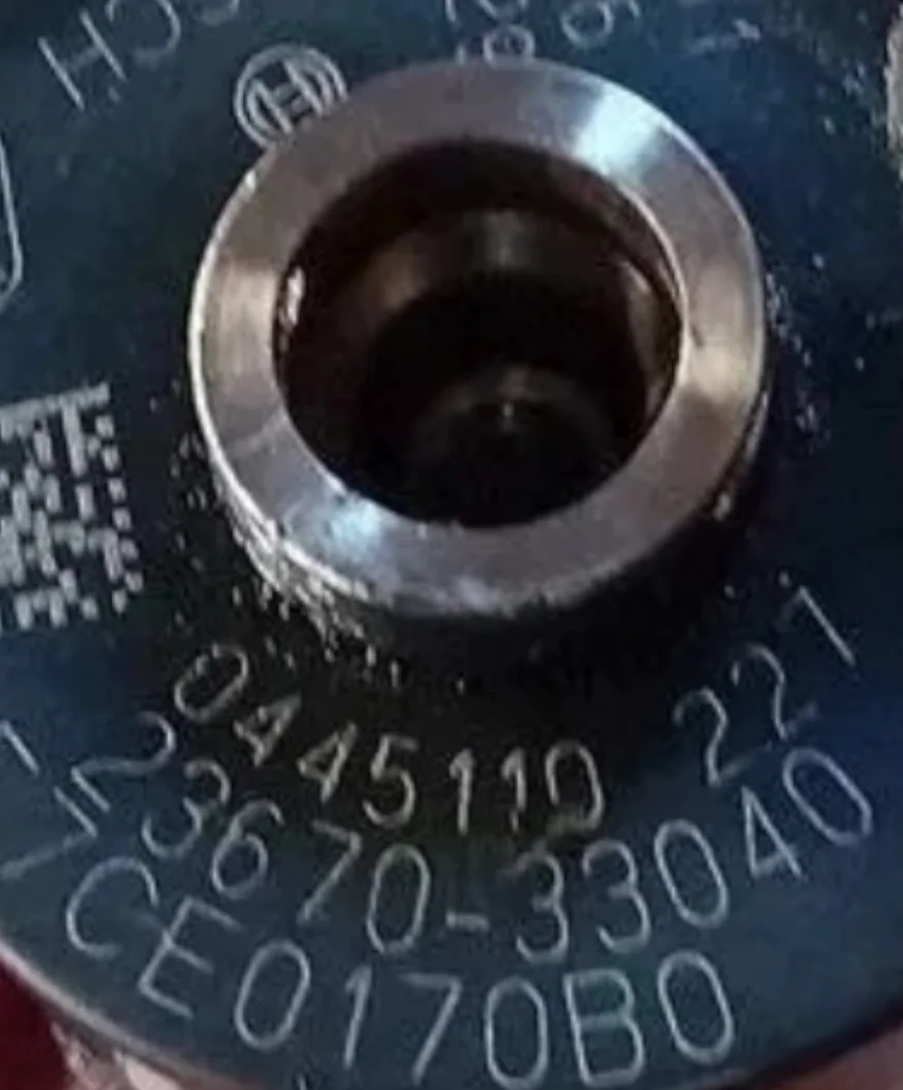 Bosch 0445110227 part-number close-up showing 0445 110 227 and Toyota OE 23670-33040