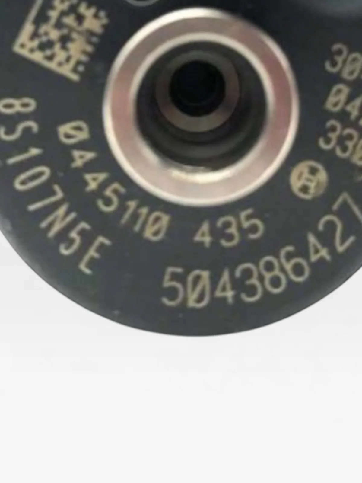 Close-up of Bosch 0445110435 part-number markings 0445110435 with data-matrix code