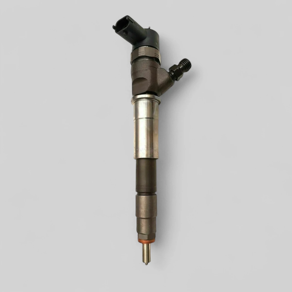 Remanufactured Bosch 0445110375 diesel injector — standing side view