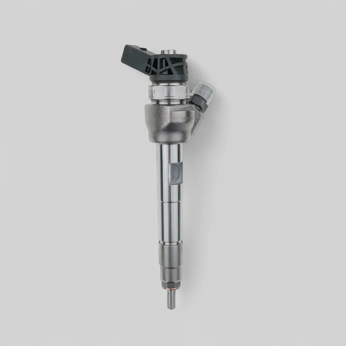 Remanufactured Bosch 0445110598 diesel injector — standing side view