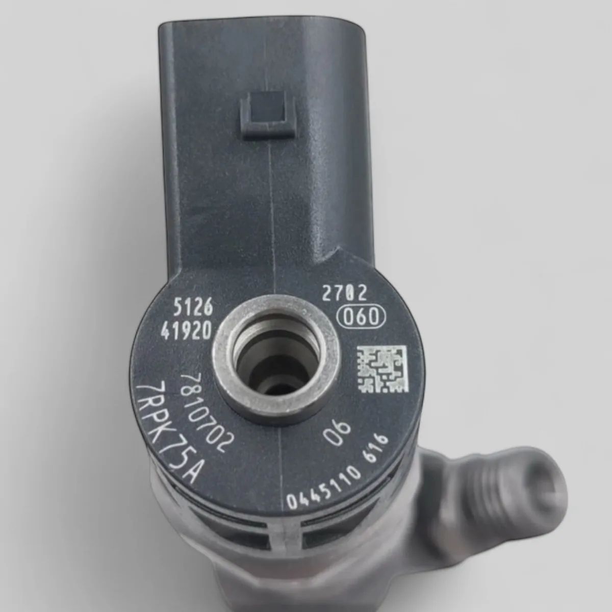 Close-up of Bosch 0445110616 part-number markings 0445110616 with data-matrix code