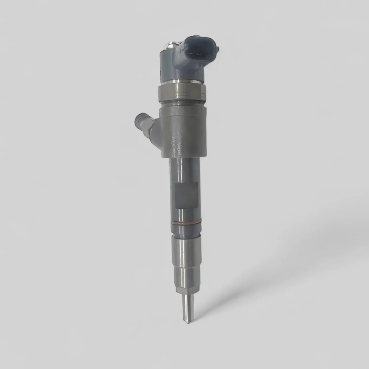 Remanufactured Bosch 0445110777 Kubota V2403 diesel injector standing — side profile