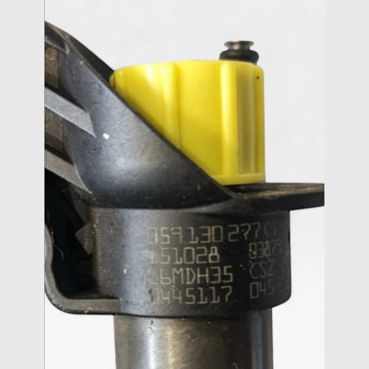 Close-up of Bosch 0445117044 part number marking with Audi OE 059130277CT