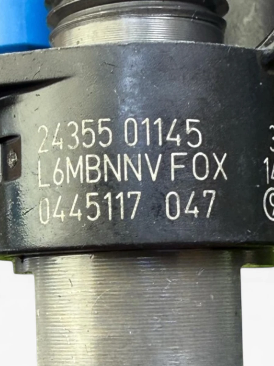 Bosch 0445117047 diesel injector close-up showing part number 0445117047 and Mercedes OE 6540700187