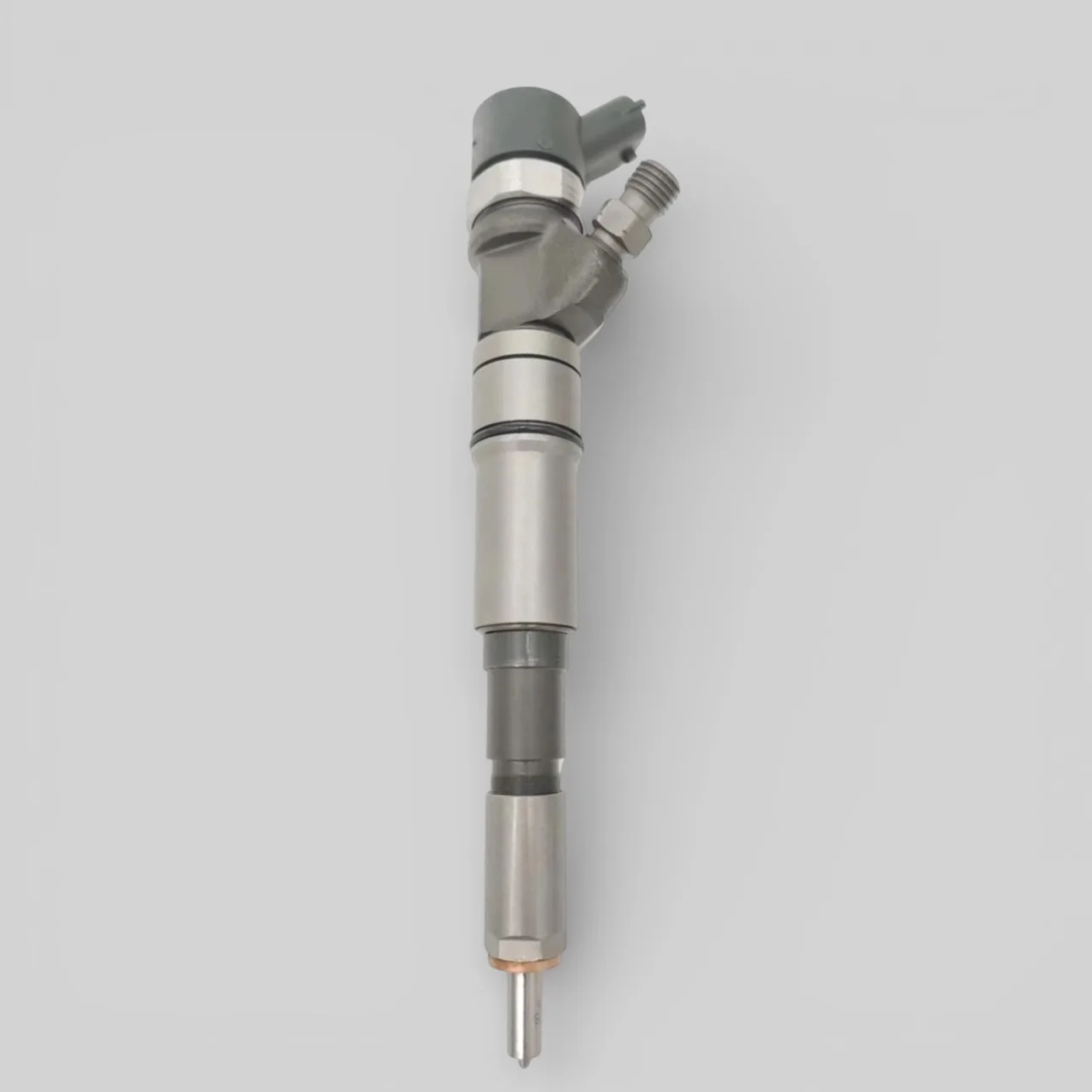 Remanufactured Bosch 0445110130 diesel injector — standing side view