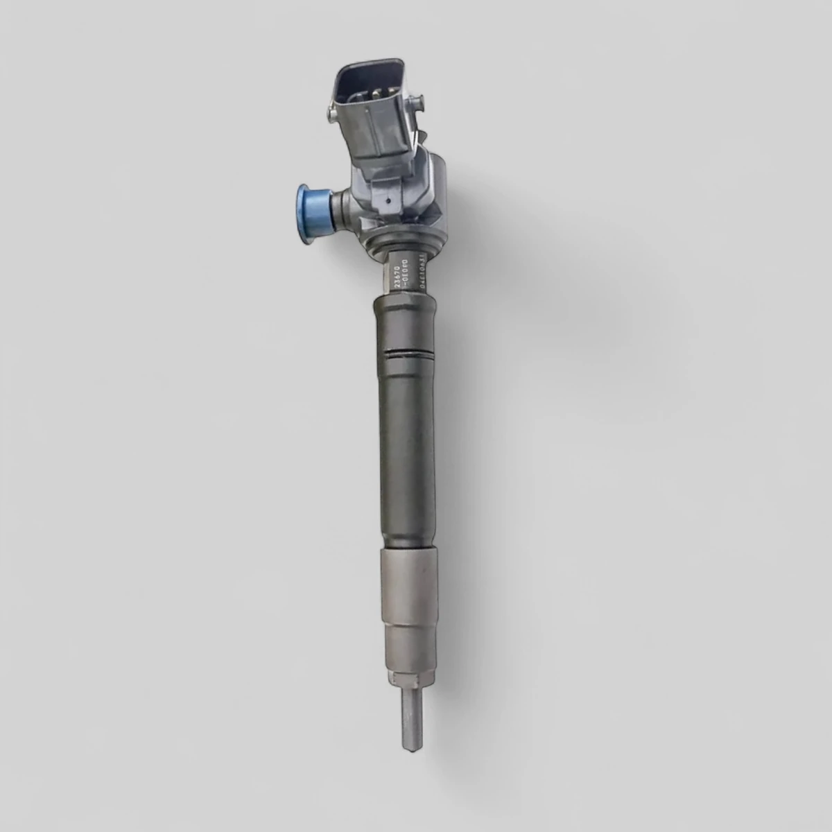 Remanufactured Denso 23670-0E070 diesel injector — standing side view