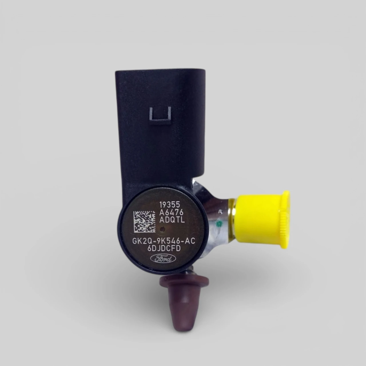 Ford GK2Q-9K546-AC 2.0 EcoBlue diesel injector solenoid head close-up showing OE part number and Ford branding