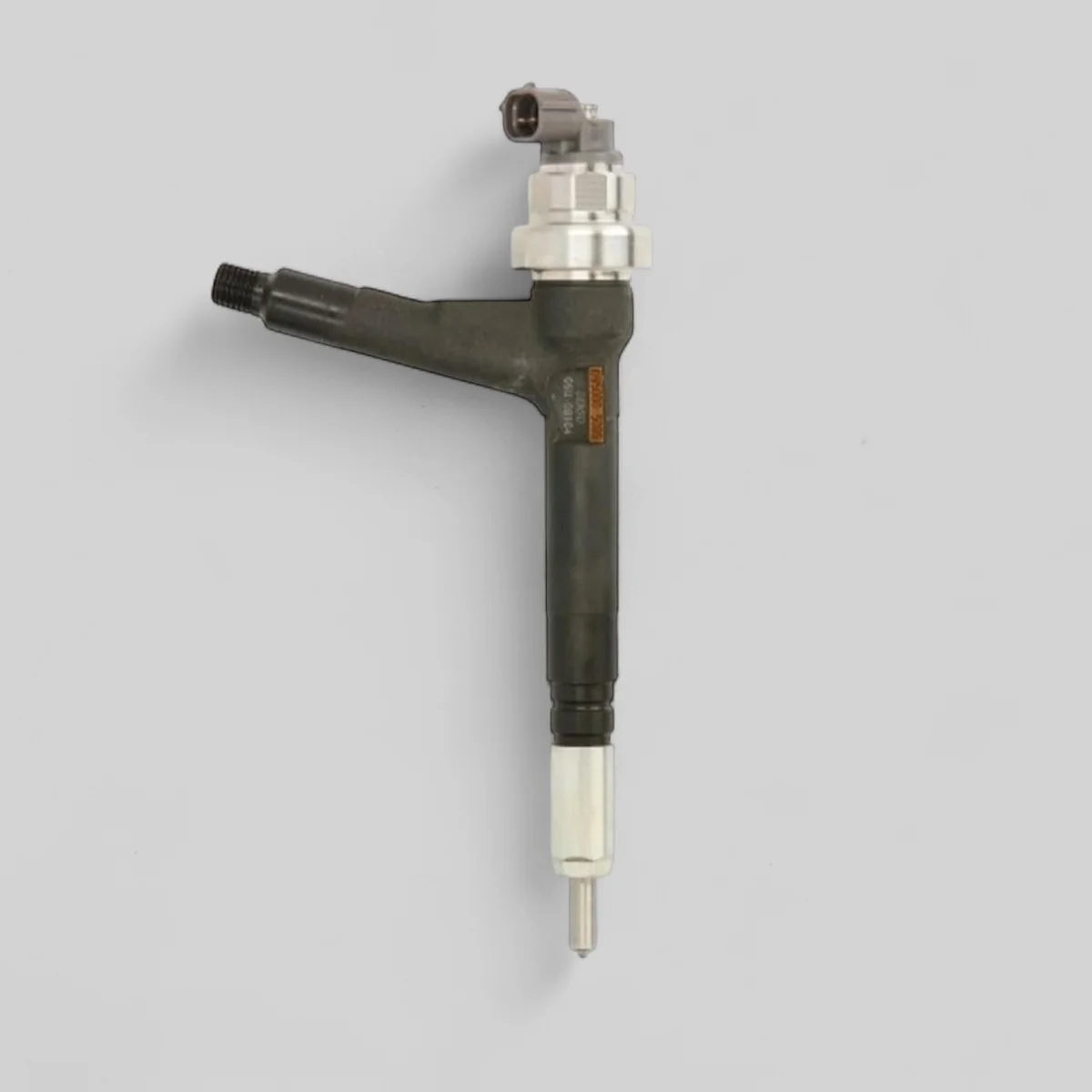 Remanufactured Denso DCRI105080 diesel injector — standing side view