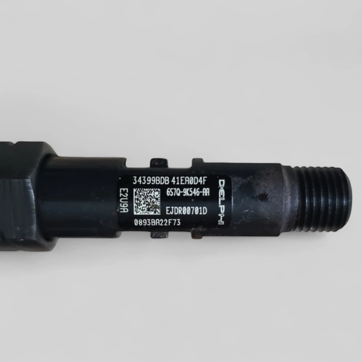 Remanufactured Delphi EJDR00701D diesel injector — part number close-up