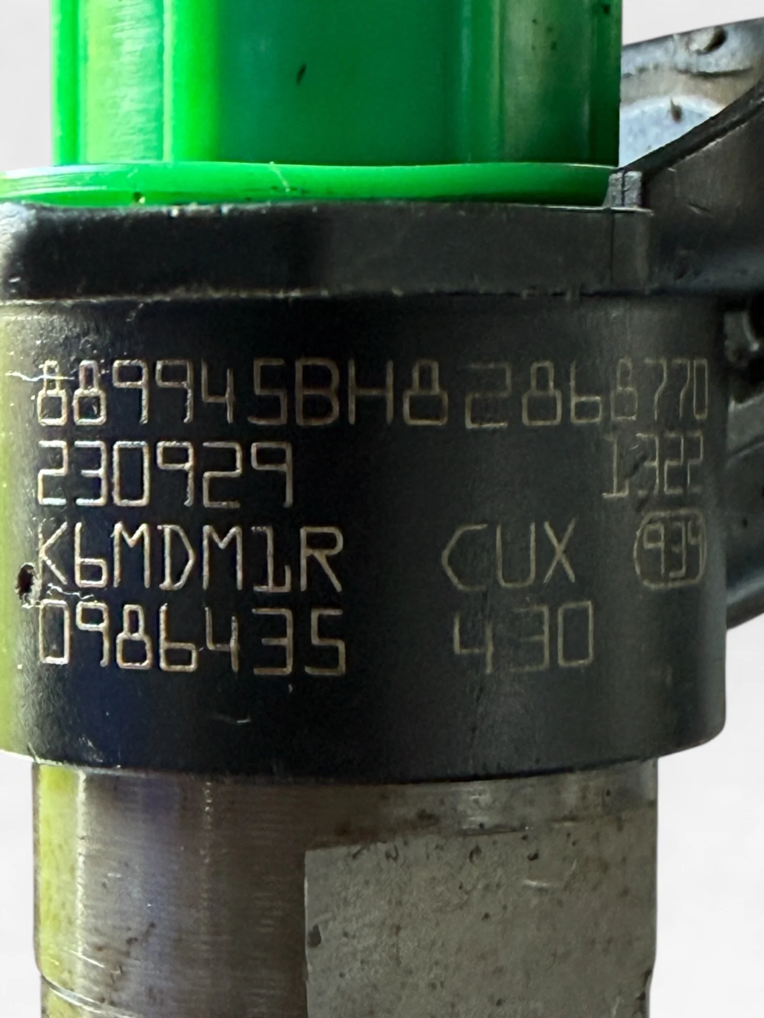 Close-up of Bosch 0445116033 V9X part number marking